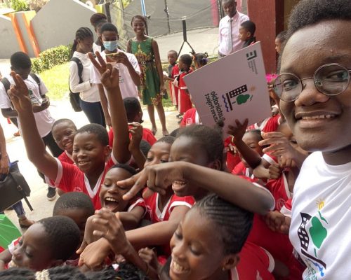 James and students at Gazelle Community School